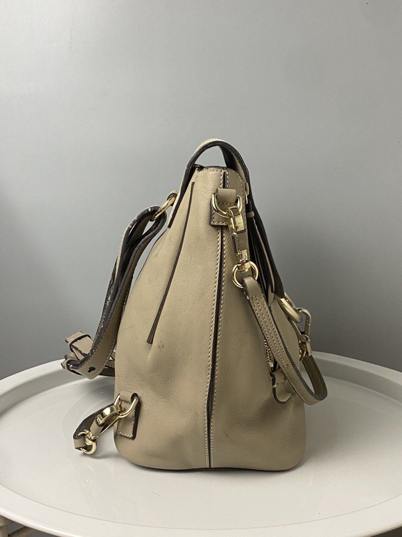 Chloe Faye Backpack (Category: Luxury Bags & Wallets) located in Tacloban City. Submitted by houseofluxury.co (Listing ID 1435349209, Image 2). Description: - Chloe Faye backpack - Neutral beige color - Flap closure with suede panel - Gold-tone ring detail - Adjustable shoulder straps and chain strap.