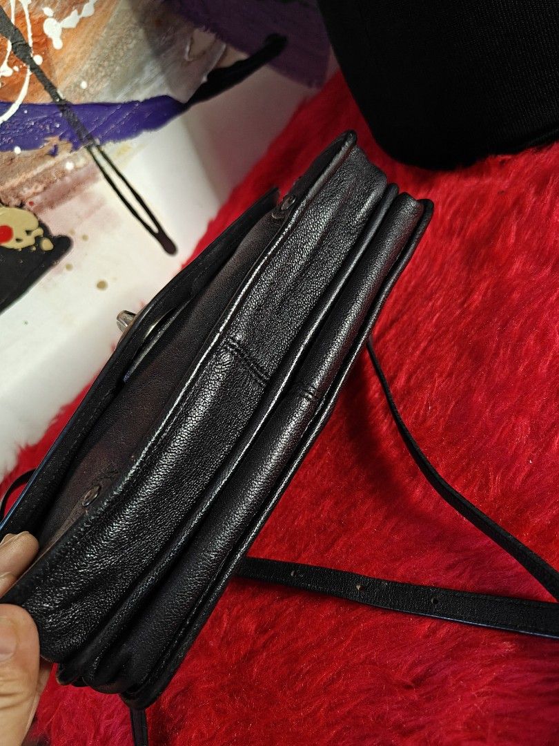 Coach Black Leather Crossbody Bag (Category: Luxury Bags & Wallets) located in Las Pinas. Submitted by liezel49 (Listing ID 1435506183, Image 3). Description: - Black leather crossbody bag - Silver-tone hardware - Flap closure with turn lock - Detachable shoulder strap - Studded design - Coach logo on front - Multiple compartments.
