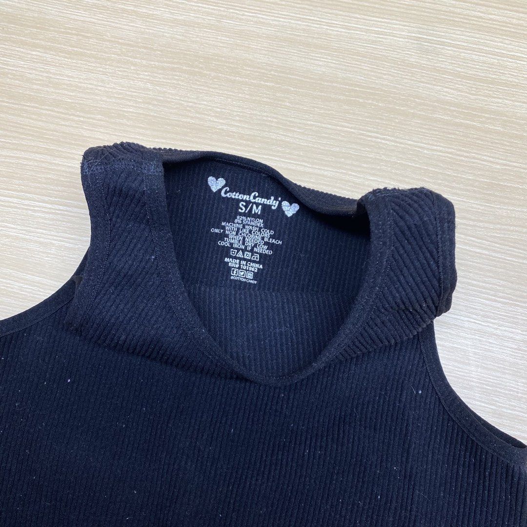 Cotton Candy Ribbed Tank Top S/M (Category: Sleeveless) located in Navotas City. Submitted by jericafits (Listing ID 1435345980, Image 2). Description: - Brand: Cotton Candy - Style: Black ribbed tank top - Size: S/M - Features: High neckline, cropped length - Material: Ribbed knit - Design: Sleeveless - Details: Perfect for layering or wearing alone. Includes care instructions on tag..