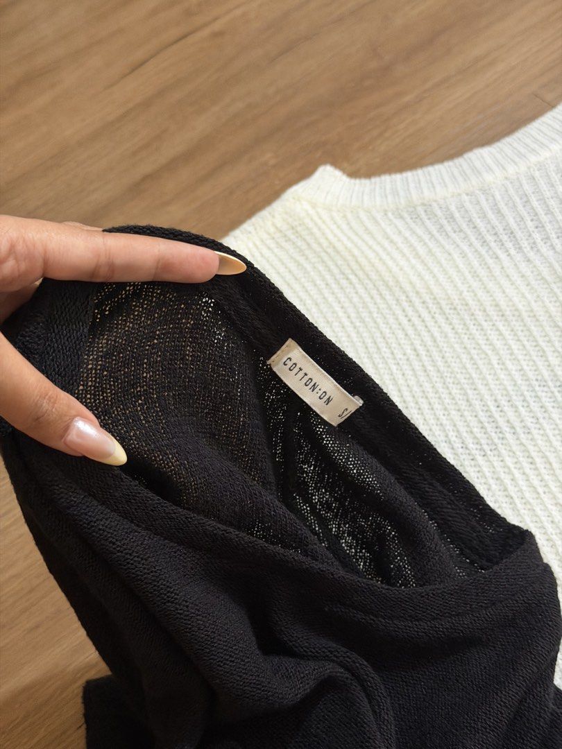 Cotton On Black and White Sweater (Category: Longsleeves) located in Mandaluyong City. Submitted by wardrobeloop (Listing ID 1435498201, Image 2). Description: - Bundle includes two knitted sweaters: - Black long-sleeved sweater (Cotton On) - White open-knit sweater with "Avicia" embroidery.