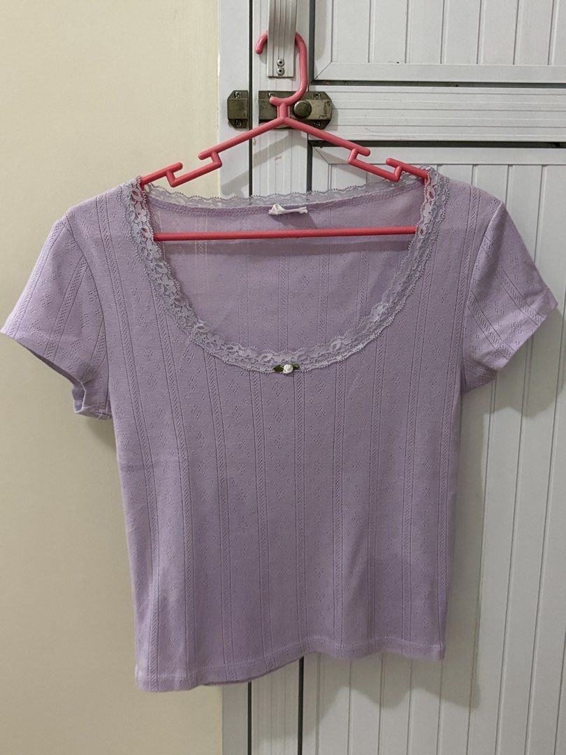 Cotton on Lace Trimmed Crop Top (Category: Sleeveless) located in Quezon City. Submitted by kimmyron.1111 (Listing ID 1435454926, Image 1). Description: - Lilac crop top - Delicate lace trim neckline - Short sleeves - Subtle textured fabric - Small floral detail at neckline.
