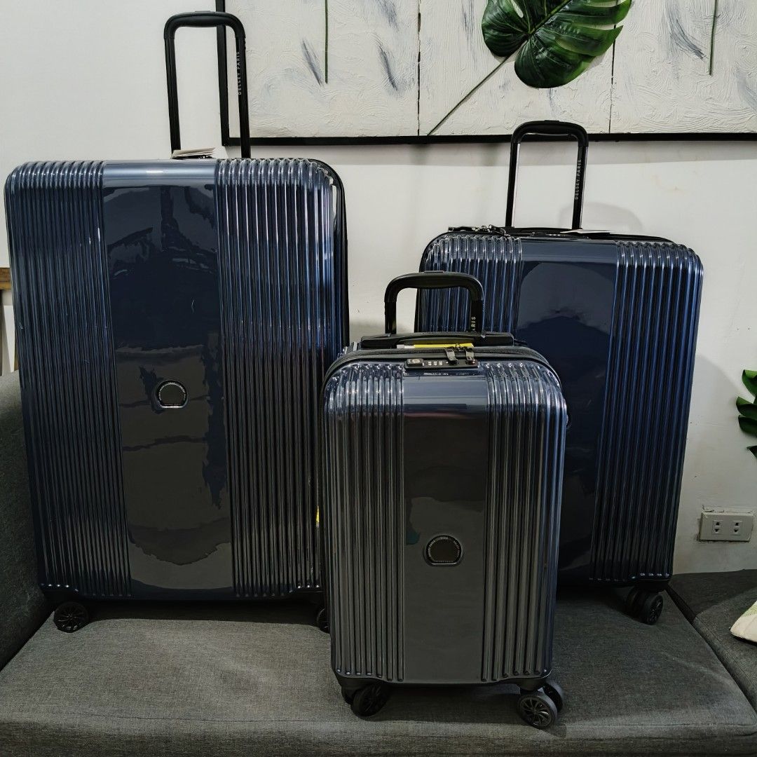 Delsey Luggage - Navy Blue (Category: Luggage) located in Caloocan City. Submitted by vtravelite.18 (Listing ID 1435418810, Image 3). Description: - Delsey luggage set in navy blue. - Set includes three pieces. - Features a stylish vertical ribbed design. - Each piece has a central circular detail. - Equipped with wheels and retractable handles for easy transport. price Starts @ small 7500 medium 85000 large 9500 - Made of durable, glossy materia
