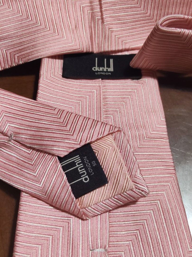 Dunhill London Pink Tie (Category: Ties) located in Cebu City. Submitted by almzcorner (Listing ID 1435415210, Image 3). Description: - Dunhill London tie - Soft pink color - Unique geometric pattern - Classic shape - Likely silk material - Perfect for formal/semi-formal occasions.