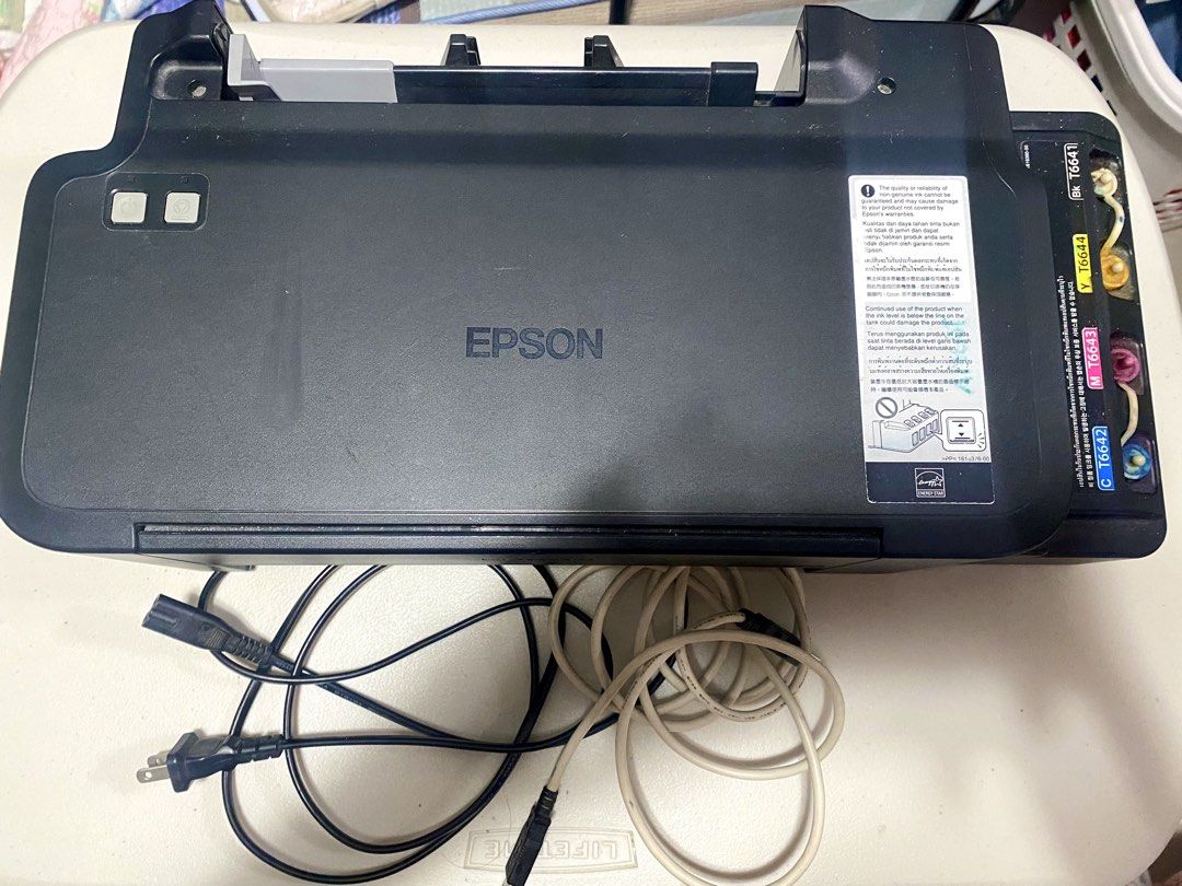 Epson L120 printer (Category: Printers, Scanners & Copiers) located in Cebu City. Submitted by cprmd (Listing ID 1435454730, Image 1). Description: FOR SALE: Epson L120 printer - Fully functional and with complete wires - Still with ink inside all 4 ink tanks - ISSUE: Needs head cleaning kay dry na sa sulod. - FREEBIES: Magenta and Black refill ink bottles - PRICE: 3,000 (slightly negotiable) - For pickup only @ Parkmall or SM JMall.