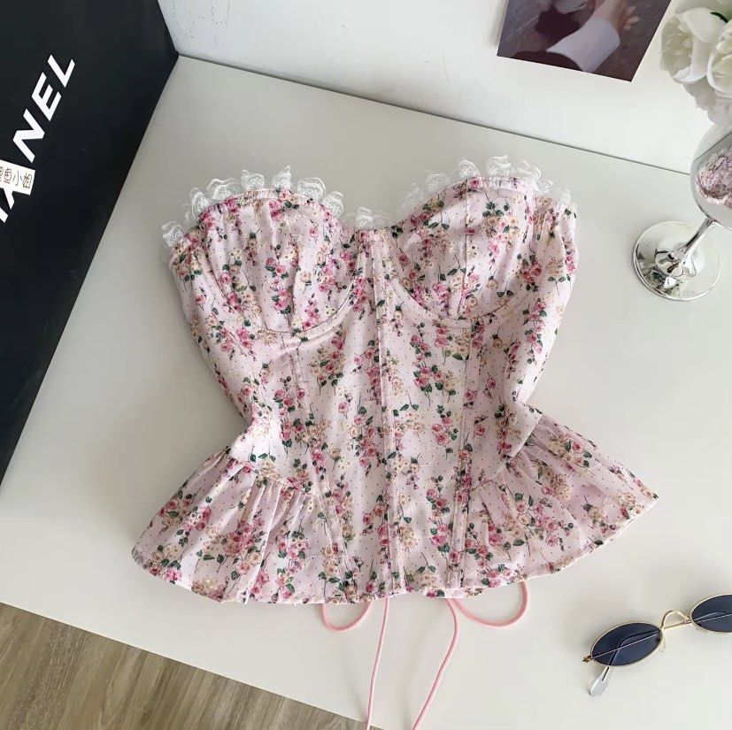 Floral Corset Top with Peplum Hem (Category: Others Tops) located in Cavite. Submitted by soleia_closet (Listing ID 1435391708, Image 2). Description: This feminine, strapless top combines structural corset elements with soft, romantic details. This versatile top is frequently styled as a "statement piece" for spring and summer, pairing well with high-waisted jeans for a casual look or a sleek midi skirt for more formal occasions..
