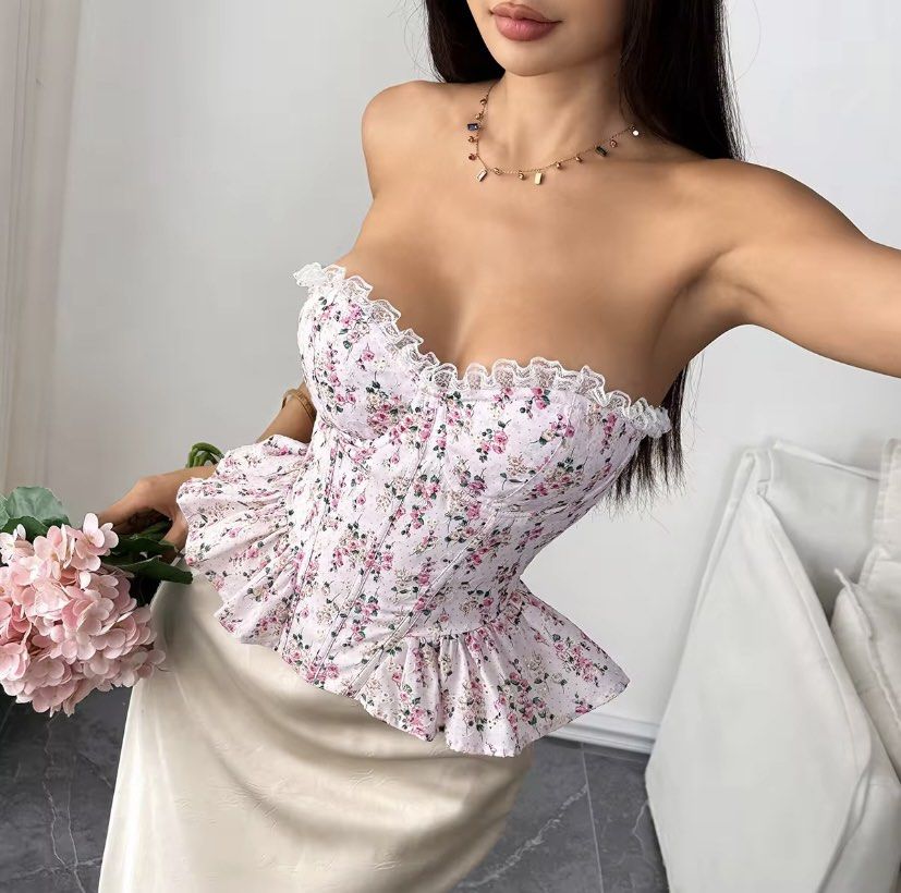 Floral Corset Top with Peplum Hem (Category: Others Tops) located in Cavite. Submitted by soleia_closet (Listing ID 1435391708, Image 1). Description: This feminine, strapless top combines structural corset elements with soft, romantic details. This versatile top is frequently styled as a "statement piece" for spring and summer, pairing well with high-waisted jeans for a casual look or a sleek midi skirt for more formal occasions..