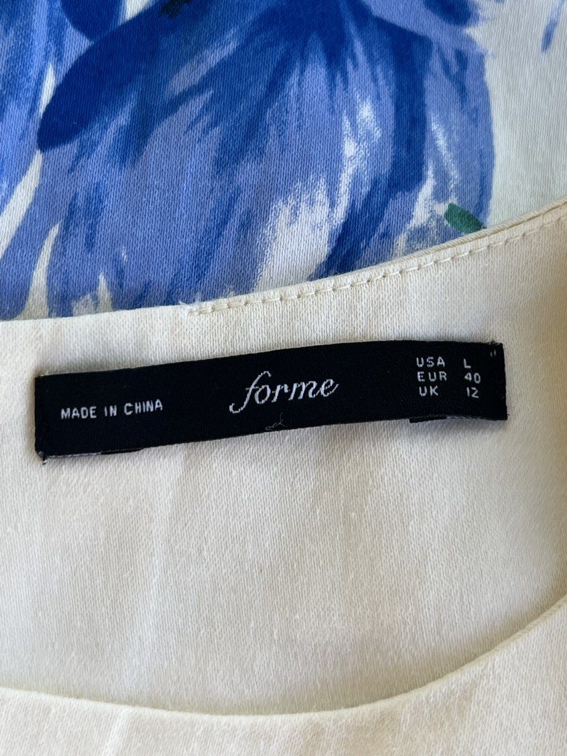 Forme Floral Sleeveless Dress (Category: Dresses) located in Naga. Submitted by ajmaq (Listing ID 1435368790, Image 3). Description: - Forme sleeveless dress - Beautiful blue floral print - Classic round neckline - Fitted silhouette - Size: L (USA), EUR 40, UK 12 - Made in China - Ideal for special occasions or everyday wear.