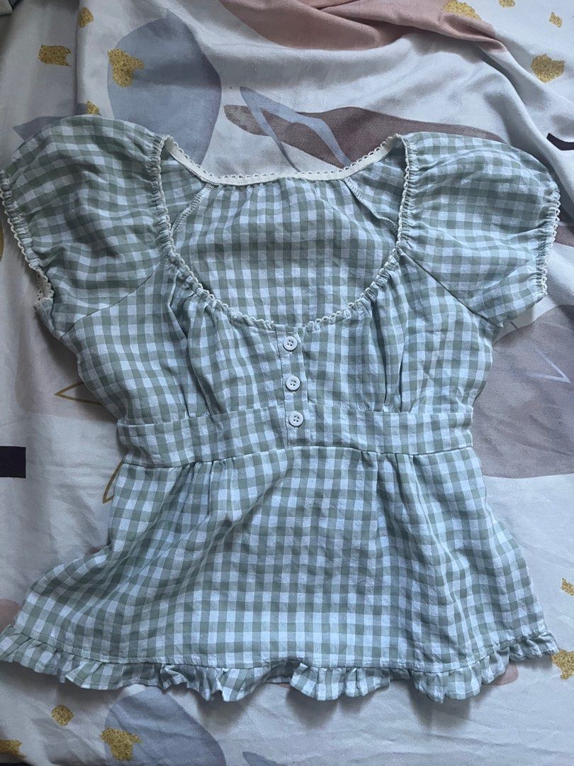 Gingham Puff Sleeve Top (Category: Blouses) located in Paranaque City. Submitted by rieclutter (Listing ID 1435410072, Image 1). Description: - can fit xs-m - Green and white gingham pattern - Puff sleeves - Square neckline - Fitted waist - Button-down front - Ruffled hem - Elasticated back for comfortable fit.