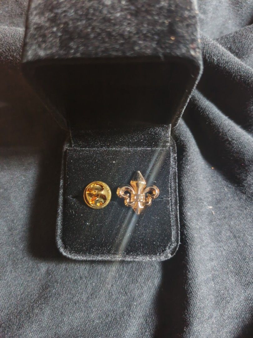 Gold-tone Fleur de Lis suit pin (Category: Brooches) located in Manila. Submitted by esteemed_shop (Listing ID 1435426794, Image 2). Description: - Scout Fleur-de-lis Pin - Includes Black Velvet Box plus ₱200 - Gold-colored metal - Detailed design - Small accessory.