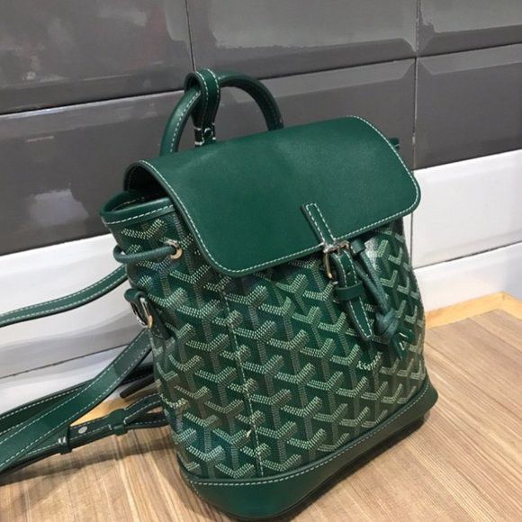Goyard Green Sling bag/Backpack (Category: Luxury Bags & Wallets) located in Pasay City. Submitted by drogon234 (Listing ID 1435470569, Image 2). Description: - Authentic Goyardine backpack in green - Features a classic flap closure with buckle - Includes a convenient top handle - Adjustable shoulder straps for a comfortable fit - Both interior and exterior are green.