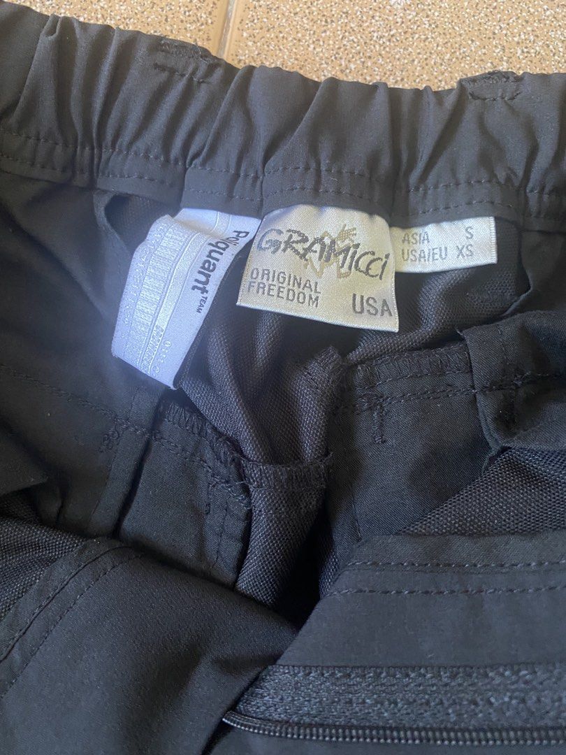 Gramicci Black Pants (Category: Trousers) located in Calapan. Submitted by yowstuff (Listing ID 1435358861, Image 2). Description: - Gramicci black pants - Size: S (Asia) / XS (EU/US) - Built-in belt - Multiple pockets - Elastic cuffs - Gramicci logo on back pocket - Drawstring and buckle closure.