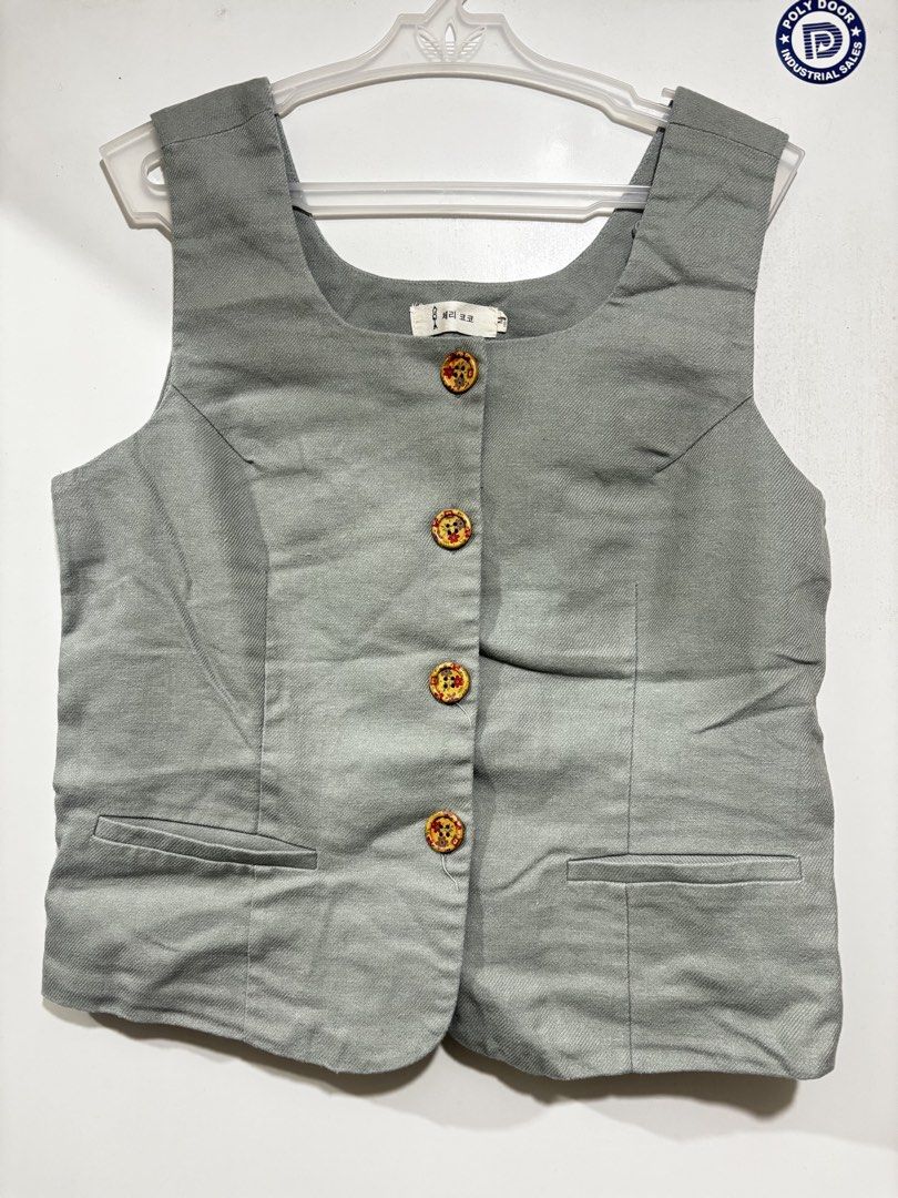 Green Linen Vest Top (Category: Sleeveless) located in Manila. Submitted by sbm_declutters (Listing ID 1435438289, Image 1). Description: Bought from Ho Chi Minh , Vietnam - Green vest - Square neckline - Decorative buttons - Tailored fit - Woven Linen fabric - Unique button design .