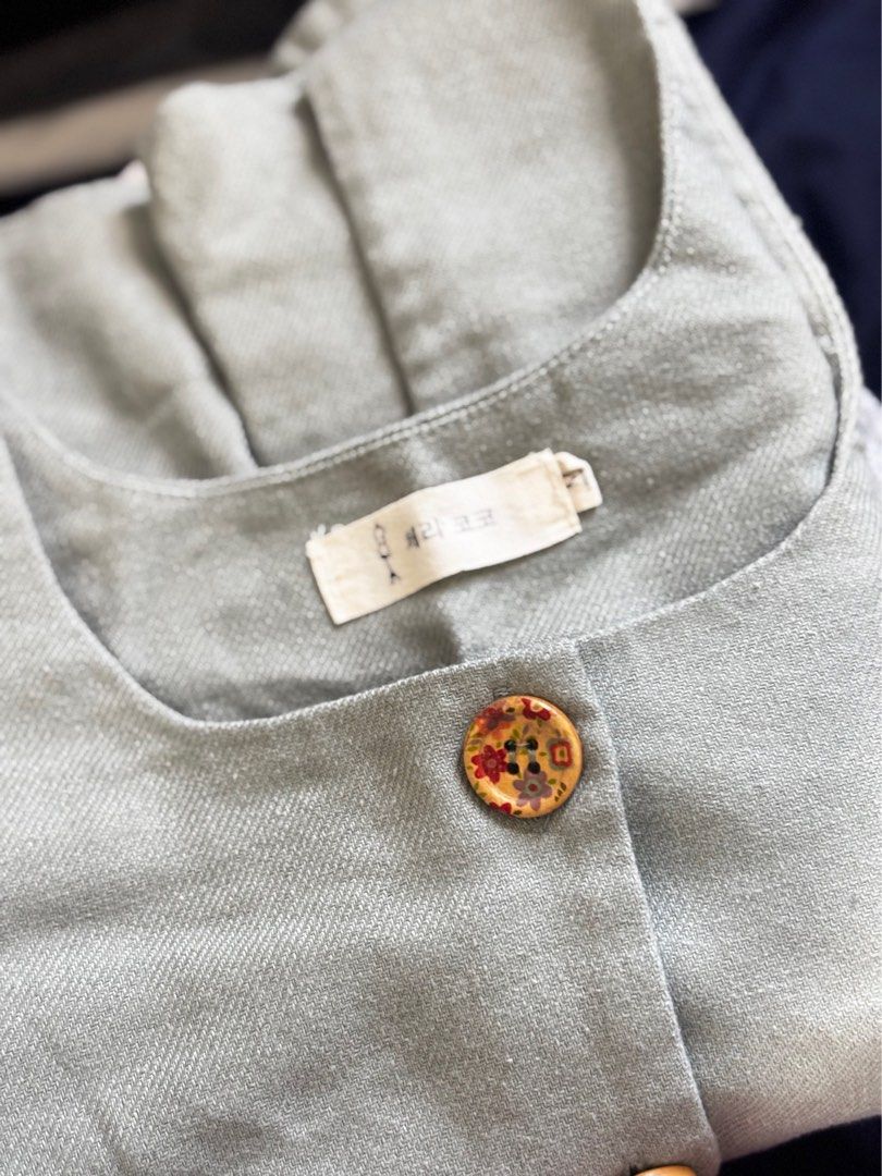 Green Linen Vest Top (Category: Sleeveless) located in Manila. Submitted by sbm_declutters (Listing ID 1435438289, Image 2). Description: Bought from Ho Chi Minh , Vietnam - Green vest - Square neckline - Decorative buttons - Tailored fit - Woven Linen fabric - Unique button design .