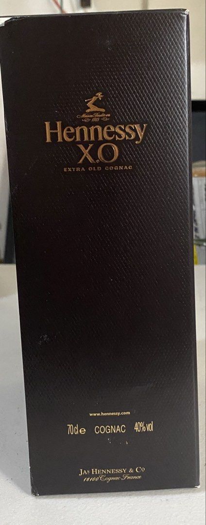 Hennessy X.O Extra Old Cognac (Category: Beverages) located in Quezon City. Submitted by bonth (Listing ID 1435399172, Image 3). Description: - Hennessy X.O Extra Old Cognac - 70cl bottle - 40% Alcohol by Volume (ABV) - Includes original box - Box features Hennessy logo and "Extra Old Cognac" text - Produced by Jas Hennessy & Co, Cognac, France - Box design includes a portrait of a man in a red coat.
