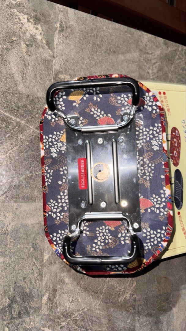Japanese Folding Stool (Category: Chairs) located in Santa Cruz. Submitted by maqui15 (Listing ID 1435359252, Image 2). Description: - Japanese folding stool - Features a vibrant red floral pattern - Sturdy metal frame with black handles - Brand new in original packaging - Includes decorative fabric cover - Compact and foldable for easy storage.