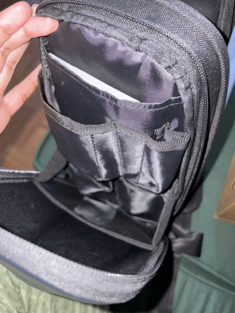 JSAUX Carrying Bag for Game Console (Category: Cases & Covers) located in Angono. Submitted by juliebabe_ (Listing ID 1435399663, Image 2). Description: - JSAUX Carrying Bag for Game Consoles - Anti-shock and wear-resistant design - Multiple storage compartments - Includes built-in accessory storage - Sleek black color - Comes with an additional accessory.