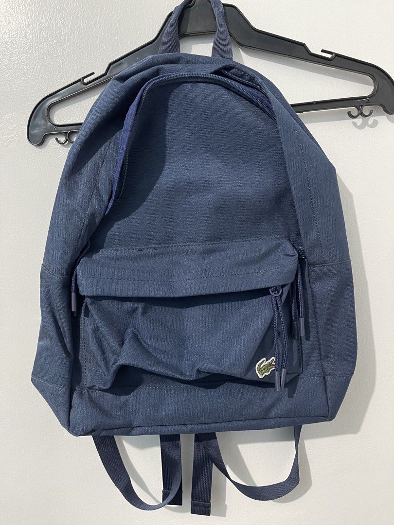 Lacoste Navy Blue Backpack Canvas (Category: Backpacks) located in Quezon City. Submitted by shopmyclutter (Listing ID 1435452705, Image 1). Description: - Navy blue Lacoste backpack - Front zipper pocket - Lacoste logo - Padded straps for comfort - Adjustable straps - Lacoste interior label Dimensions: Length: 15 inches Width: 11 inches GrabExpress or Lalamove only! Based in Metro Manila Delivery fee shouldered by buyer! Location of item: Fairvi