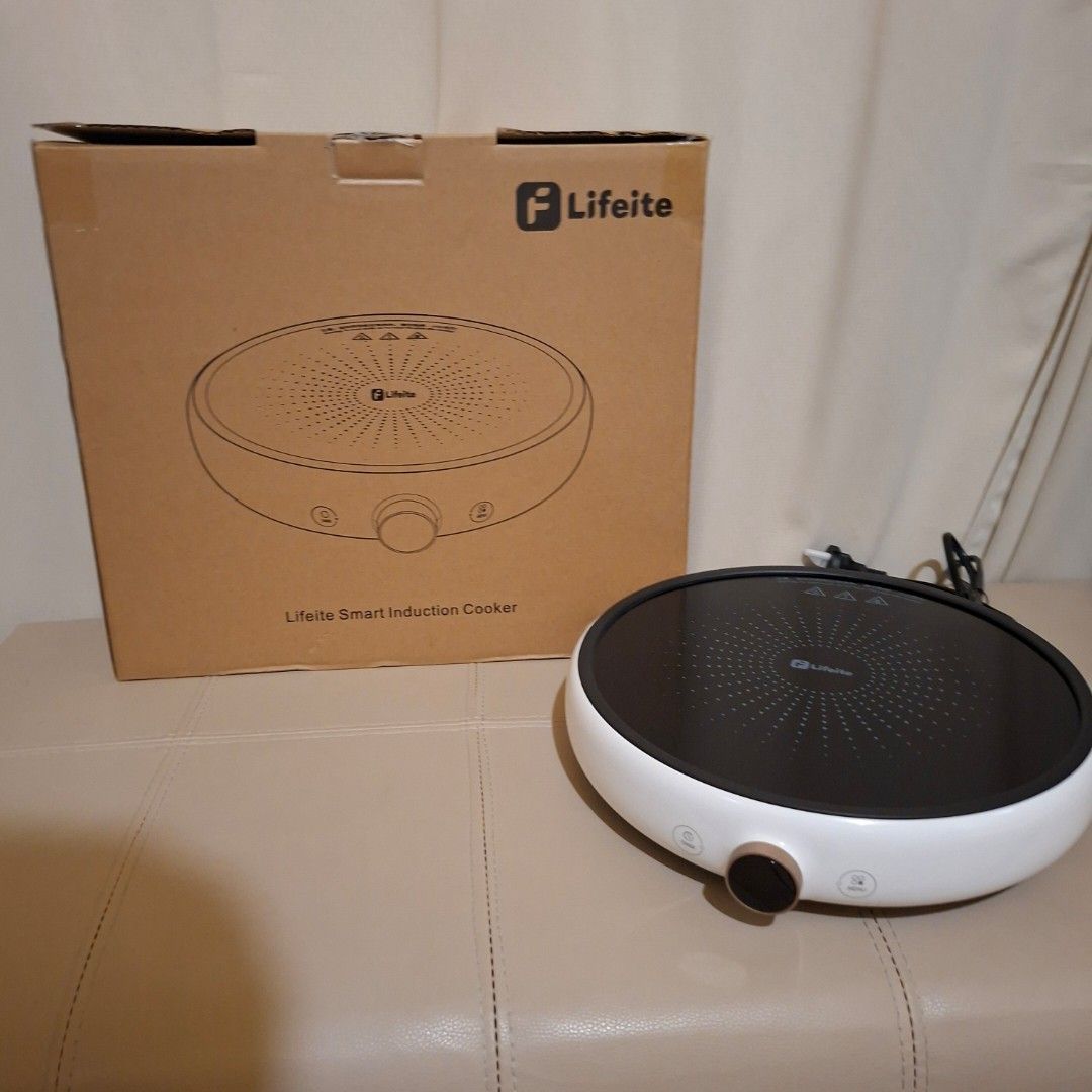 Lifeite Smart Induction Cooker xiaomi oled knob (Category: Cookers) located in Pasig City. Submitted by fast-ship (Listing ID 1435397381, Image 3). Description: - Lifeite Smart Induction Cooker - Features a white body and black cooking surface - Control panel with buttons and knob - Comes with the original box, which includes a product diagram.