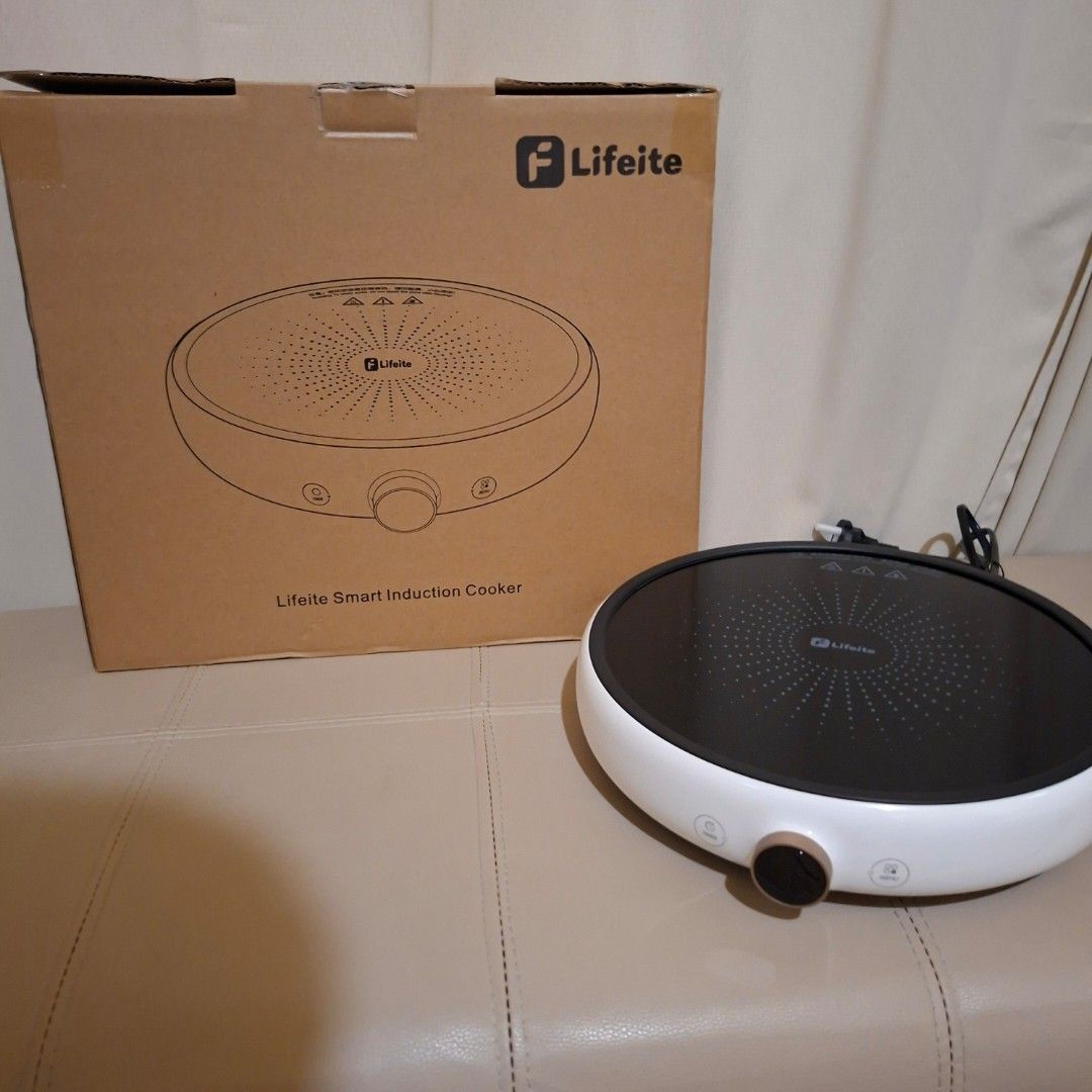Lifeite Smart Induction Cooker xiaomi oled knob (Category: Cookers) located in Pasig City. Submitted by fast-ship (Listing ID 1435397381, Image 1). Description: - Lifeite Smart Induction Cooker - Features a white body and black cooking surface - Control panel with buttons and knob - Comes with the original box, which includes a product diagram.