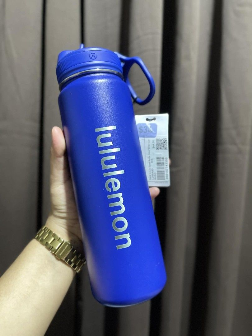 Lululemon Back to Life Sport Bottle (Category: Water Bottles & Tumblers) located in Paranaque City. Submitted by iscoappare69052 (Listing ID 1435467597, Image 3). Description: Lululemon Back to Life Sport Bottle with a handle and a straw lid. Available in two colors: a metallic silver and a vibrant blue. Both bottles have the Lululemon logo printed on the side. The silver bottle has a price tag of $48.00. The blue bottle also has a tag..
