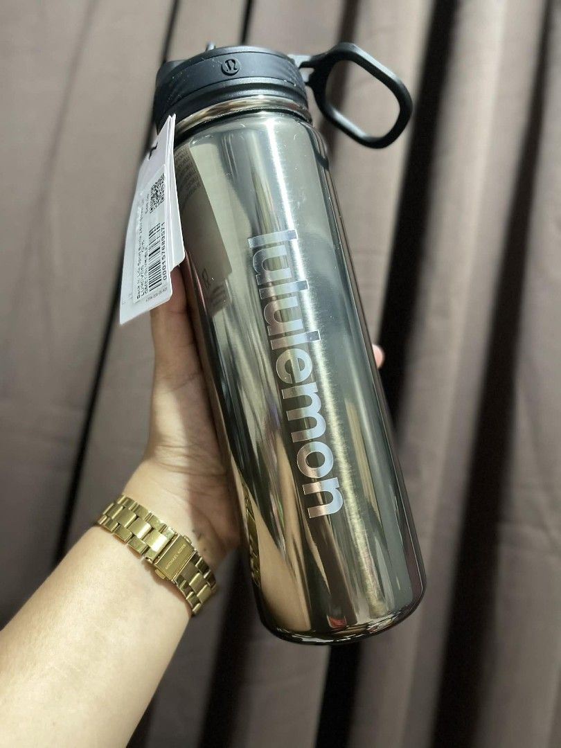 Lululemon Back to Life Sport Bottle (Category: Water Bottles & Tumblers) located in Paranaque City. Submitted by iscoappare69052 (Listing ID 1435467597, Image 1). Description: Lululemon Back to Life Sport Bottle with a handle and a straw lid. Available in two colors: a metallic silver and a vibrant blue. Both bottles have the Lululemon logo printed on the side. The silver bottle has a price tag of $48.00. The blue bottle also has a tag..