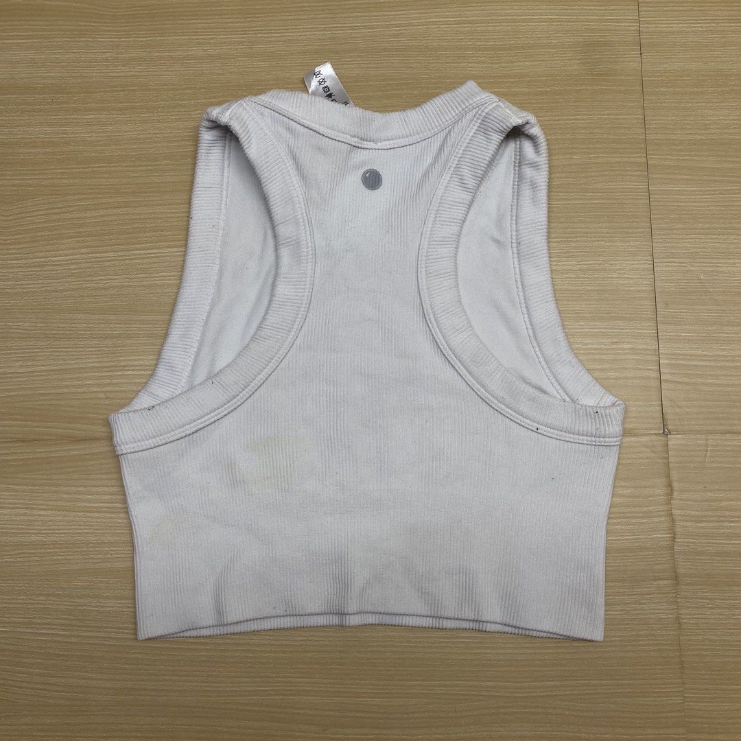 Lululemon Ribbed Tank Top - Medium (Category: Activewear) located in Navotas City. Submitted by jericafits (Listing ID 1435345971, Image 3). Description: - ribbed tank top - Size: xs-s - Color: Light - Features: Crew neck, cropped design, racerback - Texture: Ribbed - Versatile: Suitable for workouts and casual wear.