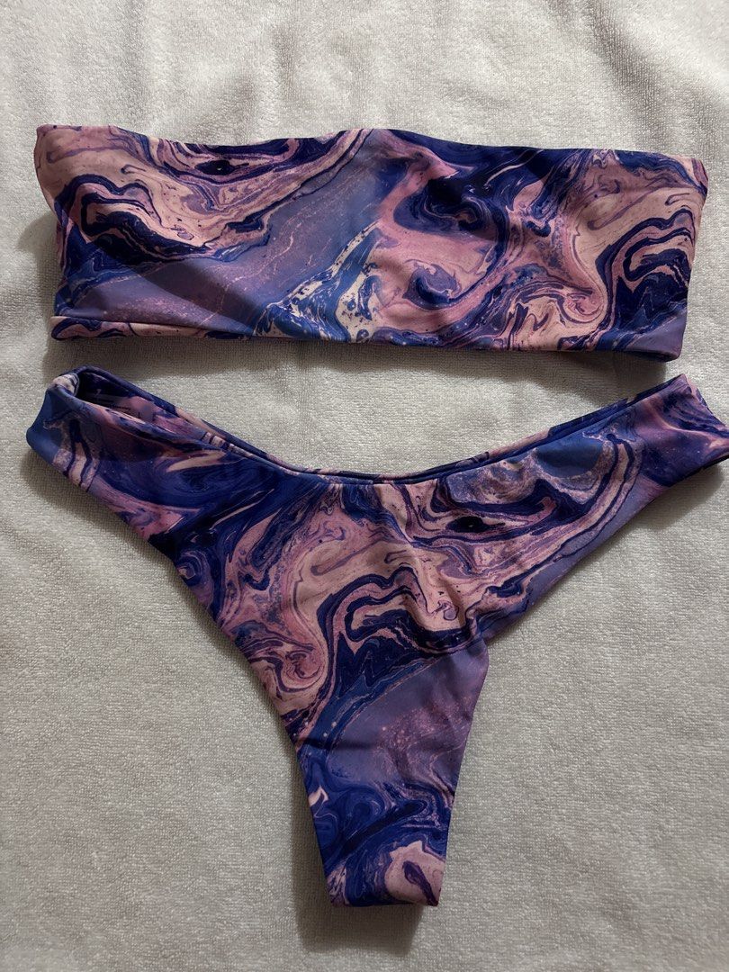 Marble Print Bikini Set (Category: Bikinis & Swimsuits) located in Makati City. Submitted by ell_declutter (Listing ID 1435382344, Image 1). Description: - Marble print bikini - Colors: Blue, purple, pink - Top: Bandeau style - Bottom: Thong cut - Smooth swimwear fabric - Ideal for beach or pool.