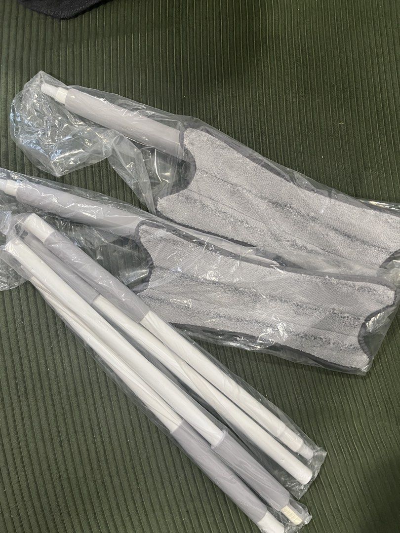 Microfiber Flat Mop Set - 2 sets (Category: Cleaning Tools & Supplies) located in Kuala Lumpur. Submitted by prelovedbymayawanda (Listing ID 1435404485, Image 1). Description: - Brand new microfiber flat mop set. - Includes mop head and extendable poles. - Mop head: Gray, unused. - Poles: White and gray. - Still in original packaging..