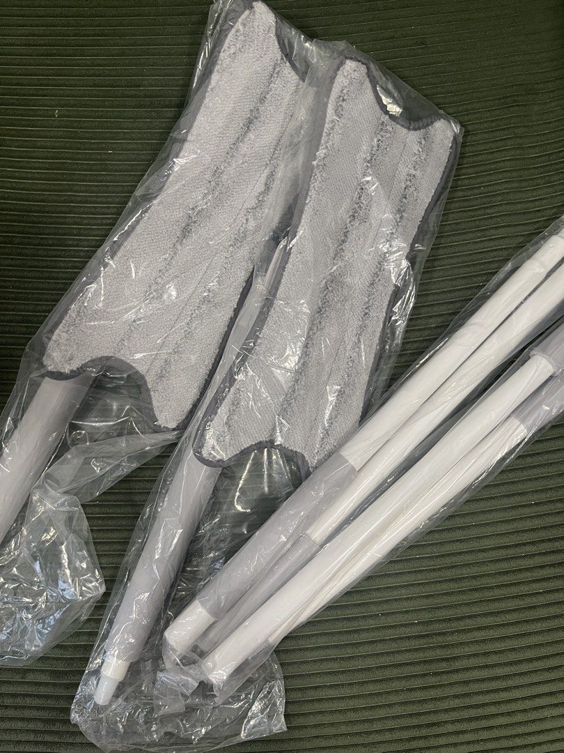 Microfiber Flat Mop Set - 2 sets (Category: Cleaning Tools & Supplies) located in Kuala Lumpur. Submitted by prelovedbymayawanda (Listing ID 1435404485, Image 2). Description: - Brand new microfiber flat mop set. - Includes mop head and extendable poles. - Mop head: Gray, unused. - Poles: White and gray. - Still in original packaging..