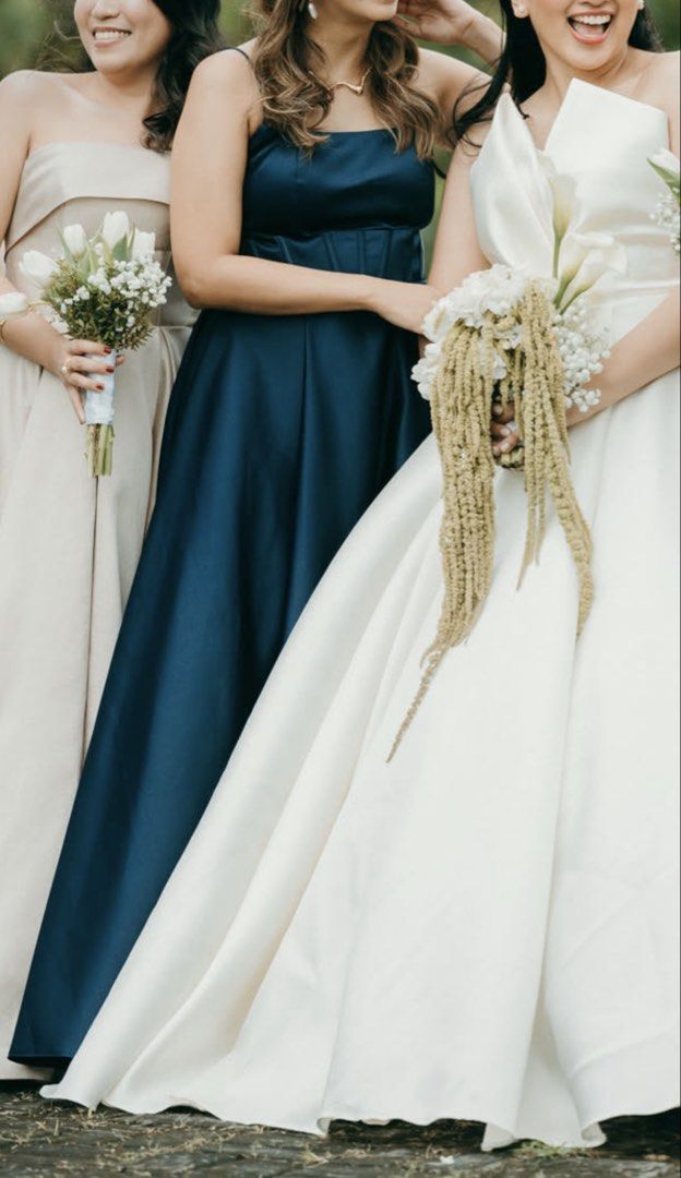 Navy Blue Gown or Dress (Category: Dresses) located in Manila. Submitted by aaavillena (Listing ID 1435405555, Image 1). Description: - Elegant navy blue formal dress - Fitted bodice with spaghetti straps - Wide waistband - Floor-length skirt with a slight train - Made of smooth, Duchess satin fabric - Ideal for special events.