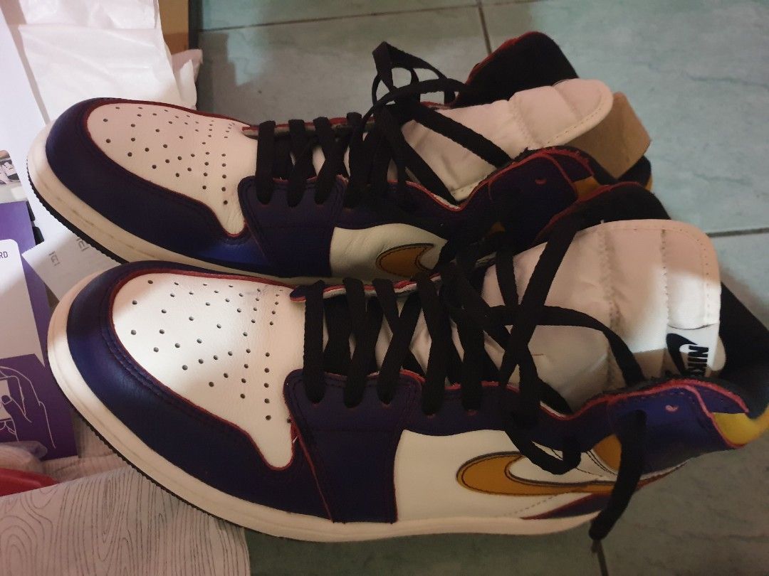 Nike Air Jordan 1 SB (Category: Sneakers) located in Pateros City. Submitted by lance_cagadoc (Listing ID 1435516784, Image 2). Description: - Air Jordan 1 SB Lakers - Colorway: White, Purple, Gold - Includes: Original box, extra laces, authentication documents - Condition: Clean soles - Features: Black laces, white tongue with Nike SB logo size 12 - Insole: Intact Nike SB dunk low size 13US no issue,with box extra lace.