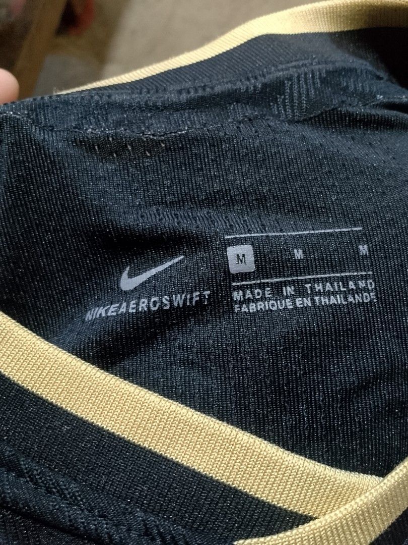Nike Barcelona Messi Jersey (Category: Activewear) located in Iloilo. Submitted by janillthrifted (Listing ID 1435388529, Image 2). Description: - Authentic Barcelona jersey - Featuring Messi's name and number 10 - Nike Aeroswift VaporKnit - Size: M - Made in Thailand - With Rakuten logo - Barcelona crest included - Color: Black base with gold accents.