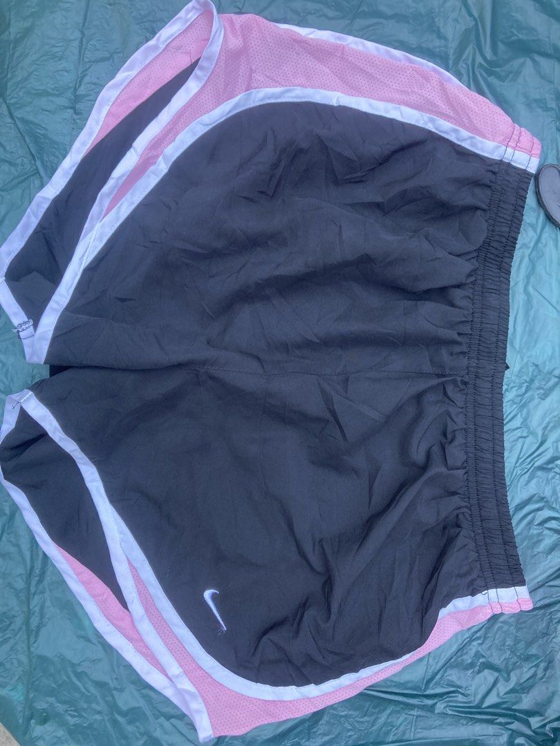 Nike Running Shorts - Black and Pink Medium (Category: Activewear) located in Tacloban City. Submitted by sid1999 (Listing ID 1435427704, Image 2). Description: - Nike running shorts - Black with pink mesh detailing and white trim - Elastic waistband - Nike swoosh logo - Suitable for athletic activities Dimensions Waist 14 stretchable length 13 inches Issues: removed yung inner 100% authentic guaranteed.