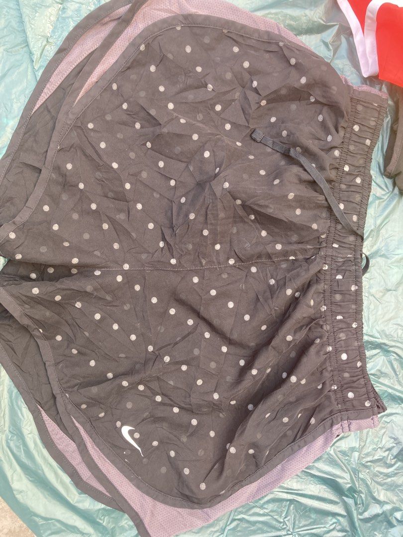 Nike Running Tempo Shorts - Size L (Category: Shorts) located in Tacloban City. Submitted by sid1999 (Listing ID 1435425222, Image 1). Description: - Nike running shorts - Size: L - Color: Dark grey with white polka dots - Features: Drawstring waistband, built-in liner, small Nike logo - Perfect for running and athletic activities Dimensions 14 inch waist stretchable length 15 Looks darker in person Lighting may affect image.