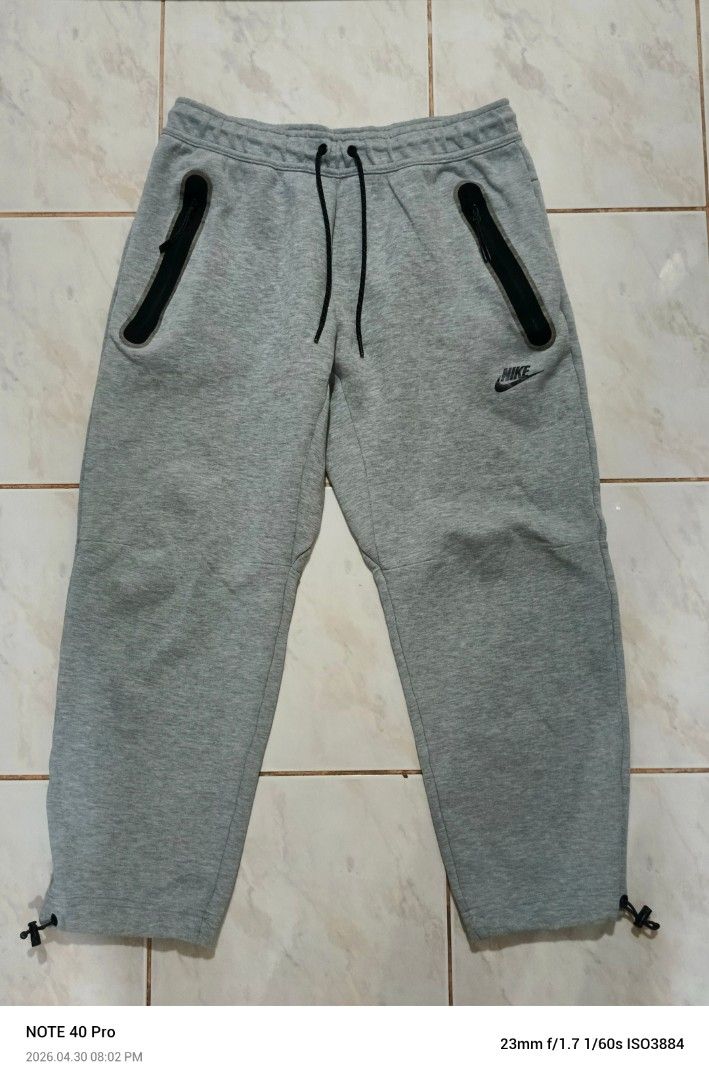 Nike Tech Fleece Jogger Pants - Gray - Size L (Category: Joggers) located in Manila. Submitted by jeffies4ti96921 (Listing ID 1435344413, Image 1). Description: - Nike Tech Fleece joggers - Color: Gray - Size: L - Features: - Drawstring waist - Zippered pockets - Nike logo detail - Made in Vietnam - Measurements (approximate): - Waist: 15 inches - Length: 38 inches.