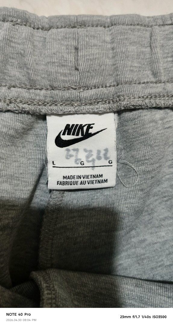 Nike Tech Fleece Jogger Pants - Gray - Size L (Category: Joggers) located in Manila. Submitted by jeffies4ti96921 (Listing ID 1435344413, Image 2). Description: - Nike Tech Fleece joggers - Color: Gray - Size: L - Features: - Drawstring waist - Zippered pockets - Nike logo detail - Made in Vietnam - Measurements (approximate): - Waist: 15 inches - Length: 38 inches.