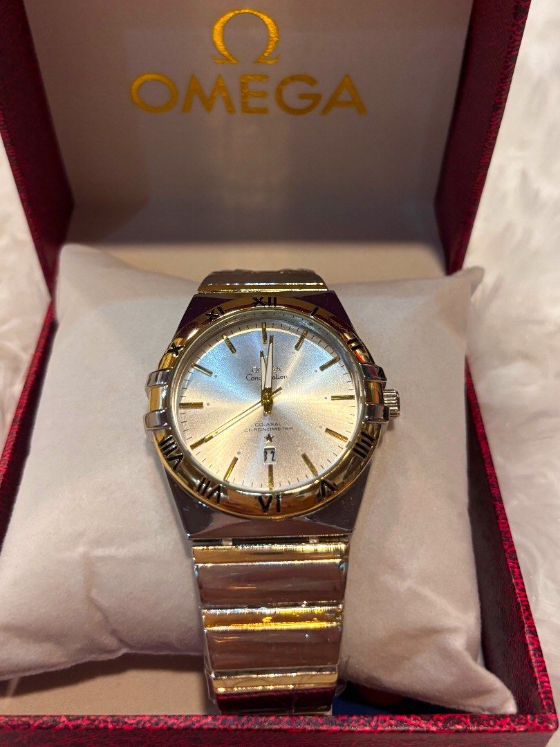 Omega Constellation Watch (Category: Luxury Watches) located in Cebu City. Submitted by day.98 (Listing ID 1435470724, Image 1). Description: - Omega Constellation watch - Silver dial with gold accents - Features Roman numeral hour markers - Date display function - Two-tone stainless steel and gold bracelet - Comes with original Omega box.
