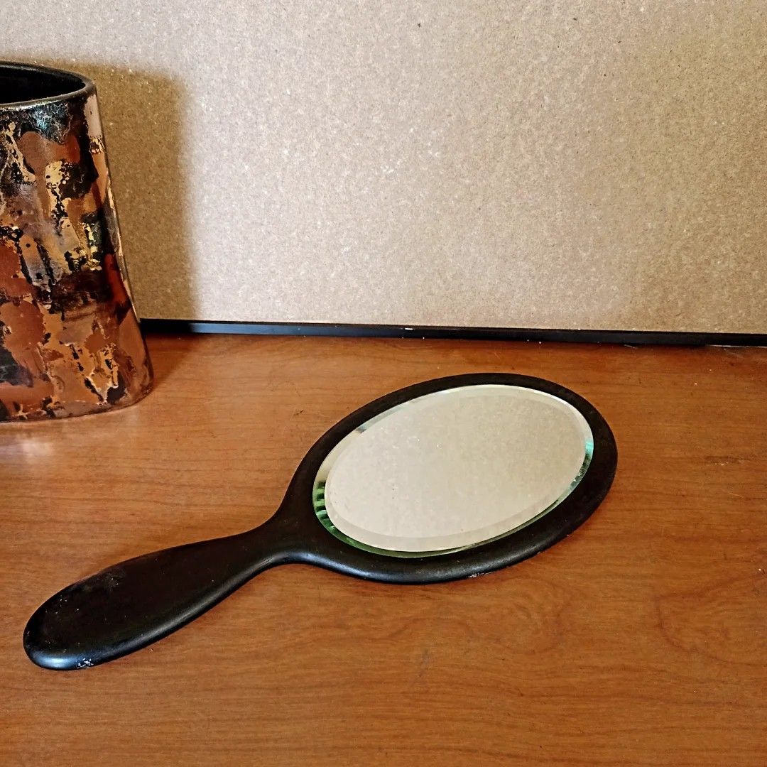 Oval Handheld Mirror (Category: Mirrors) located in Baguio. Submitted by klutter.curio (Listing ID 1435419835, Image 1). Description: - Oval mirror surface - Black frame and handle - Comfortable grip - Classic design - Ideal for personal grooming and makeup application.