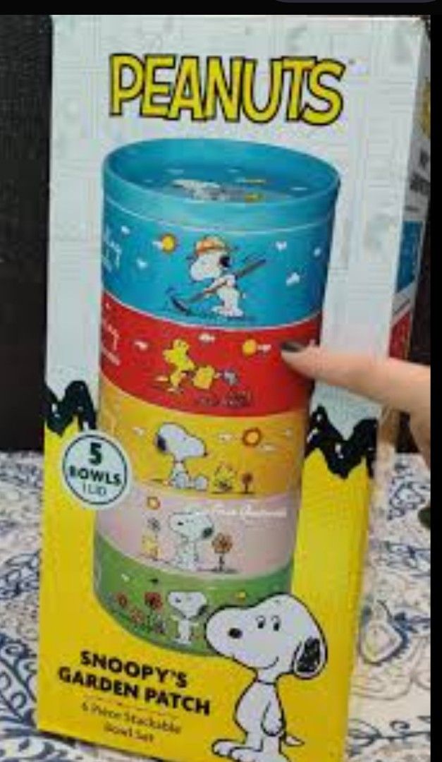 Peanuts Snoopy's Garden Patch Bowl Set (Category: Other Kitchenware & Tableware) located in Makati City. Submitted by gaile_24 (Listing ID 1435467508, Image 1). Description: This is a Peanuts Snoopy's Garden Patch 6-piece stackable bowl set, featuring five decorated stoneware bowls and a stoneware lid. Components: Includes 5 bowls (approx. 5.5 inches) and 1 stoneware lid. Design: Features colorful artwork of Snoopy and Woodstock from the "Garden 
