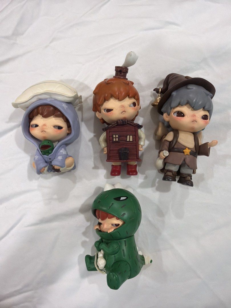 Pop Mart Dimoo World Series Figurines (Category: Designer & Blind Box Toys) located in Makati City. Submitted by _saleph_ (Listing ID 1435386915, Image 1). Description: - Four Dimoo World Series figurines included. - Features: - Blue hooded figure - House-shaped figure - Wizard-themed figure - Green dinosaur figure - Unique designs and poses. - Perfect for collectors and gifts. - 1500 for all - 500 each .