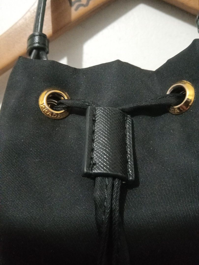 Prada bucket bag riri zip (Category: Luxury Bags & Wallets) located in Santo Tomas. Submitted by rexadominice (Listing ID 1435478367, Image 3). Description: Prada bucket bag riri zip small flaws see last pic at missing sling.
