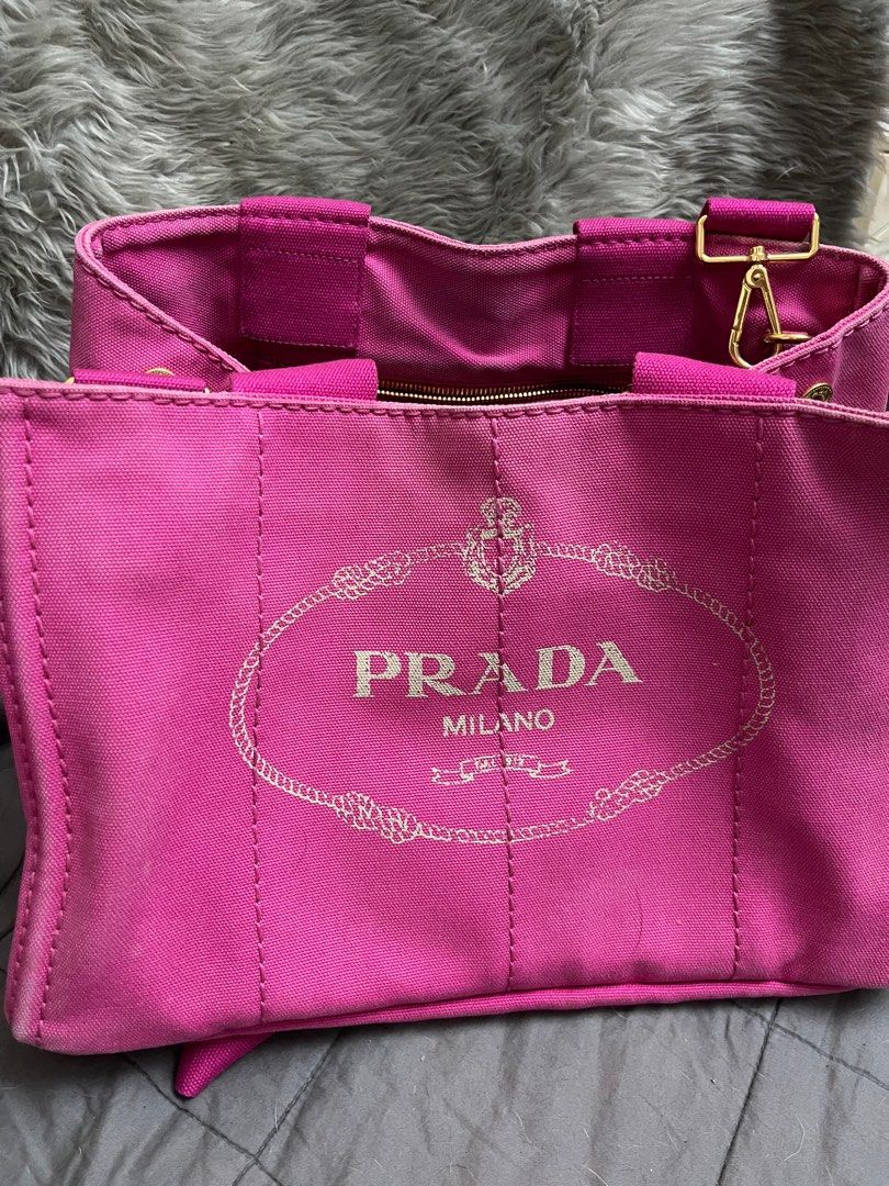 Prada Canapa Tote Bag (Category: Luxury Bags & Wallets) located in Muntinlupa City. Submitted by karmeeda_p (Listing ID 1435455058, Image 1). Description: Price negotiable. No to low-ballers - Authentic Prada Canapa tote bag - Color: Pink - Material: Canvas - Hardware: Gold-tone - Includes: Detachable strap and authenticity cards - Features Prada logo - Gold studs on the bottom - Made in Italy.