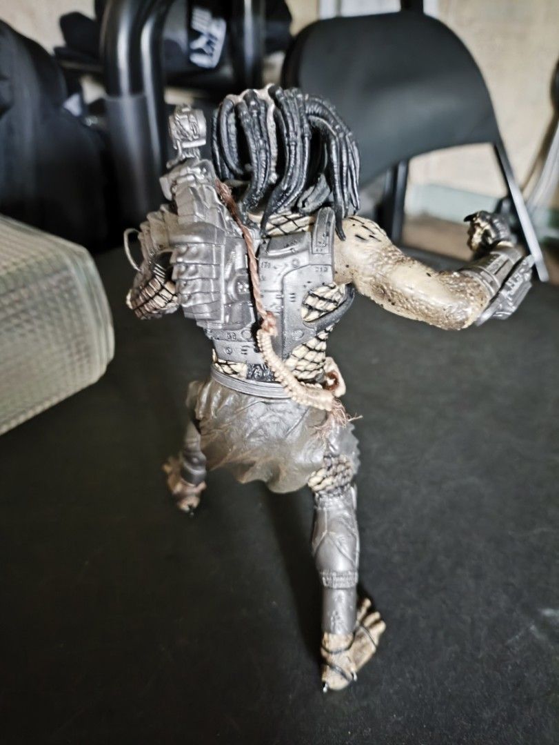 Predator Action Figure (Category: Action & Battle Toys) located in Quezon City. Submitted by sejleon (Listing ID 1435395340, Image 3). Description: - No trades - Loose, claw is slightly worn off - Original McFarlane - Highly detailed Predator action figure - Features articulated joints for posing - Includes shoulder-mounted weapon and accessories - Perfect for Predator franchise collectors.