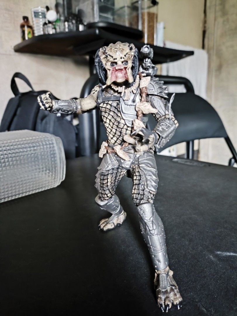 Predator Action Figure (Category: Action & Battle Toys) located in Quezon City. Submitted by sejleon (Listing ID 1435395340, Image 2). Description: - No trades - Loose, claw is slightly worn off - Original McFarlane - Highly detailed Predator action figure - Features articulated joints for posing - Includes shoulder-mounted weapon and accessories - Perfect for Predator franchise collectors.