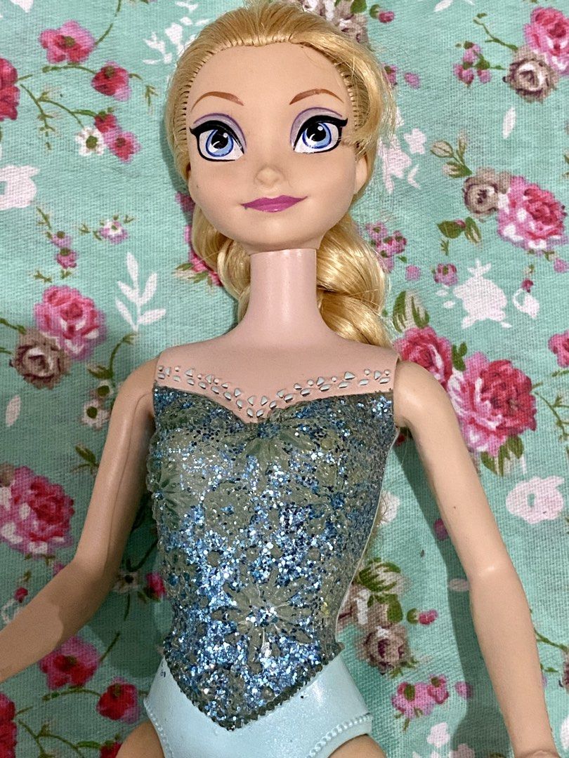 Preloved elsa barbie doll (Category: Kids Toys) located in Binan City. Submitted by myutopia28 (Listing ID 1435366307, Image 1). Description: As is Needs cleaning and battery. Preloved collectible Disney Frozen Elsa doll, specifically a model likely from the “Musical Magic” line released around 2013-2014, featuring electronic musical features activated by contact points on the palms. Mattel brand.