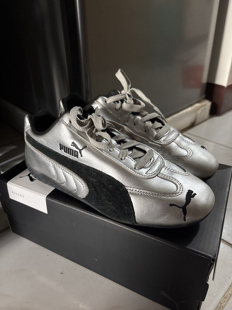 Puma Silver Sneakers (Category: Sneakers) located in Makati City. Submitted by ell_declutter (Listing ID 1435385771, Image 1). Description: - Silver Puma sneakers - Black suede panel detail - Puma logo on side and tongue - Includes original box - Classic lace-up design - Rounded toe.