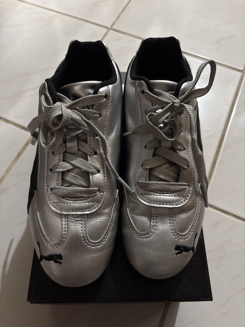 Puma Silver Sneakers (Category: Sneakers) located in Makati City. Submitted by ell_declutter (Listing ID 1435385771, Image 3). Description: - Silver Puma sneakers - Black suede panel detail - Puma logo on side and tongue - Includes original box - Classic lace-up design - Rounded toe.
