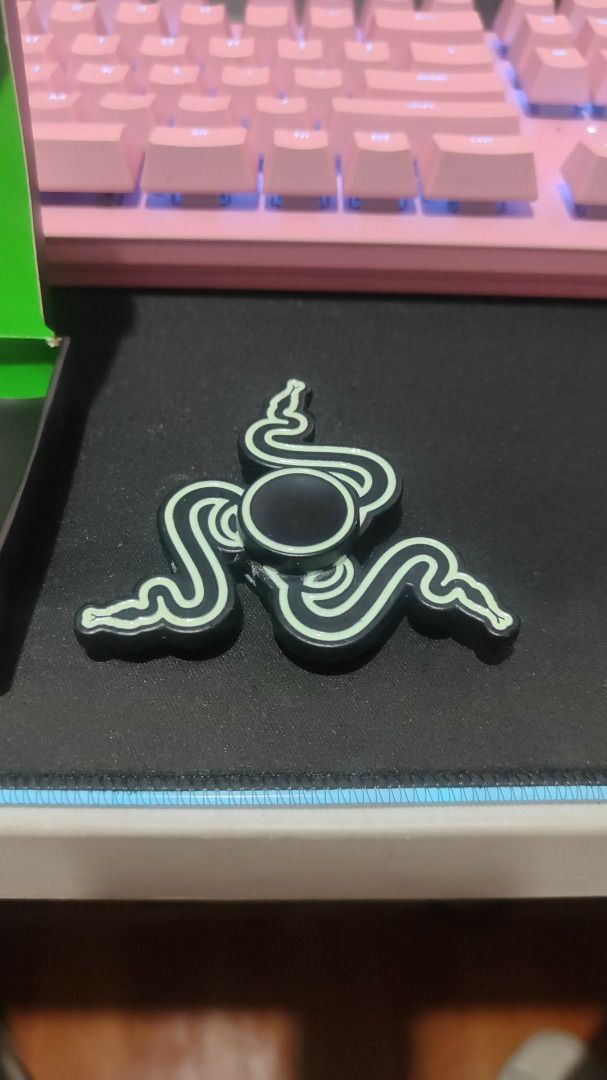 Razer THS Spinner (Category: Controllers) located in Manila. Submitted by cooldude0613 (Listing ID 1435339099, Image 2). Description: The Razer THS Spinner is a small fidget spinner gadget released by Razer, mainly as a promotional or collectible item rather than a mainstream retail product. 🔧 Key Details Type: Fidget spinner / stress-relief toy Design: Shaped like Razer’s triple-headed snake logo Material: Typically metal body with steel bearin