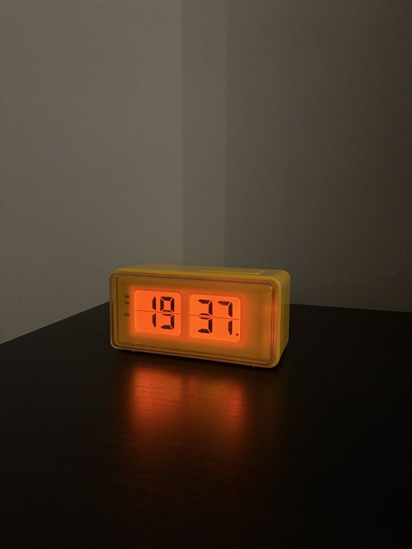 Flip Clock Style Retro Design Digital Alarm Clock (Yellow) (Category: Other Home Appliances) located in Pasig City. Submitted by cash800 (Listing ID 1435458955, Image 1). Description: Retro design Light and alarm function Battery operated Size: 127 x 62 x 58 mm (2) AA Batteries Materials: ABS, ETC Issue: small crack, only noticeable up close.