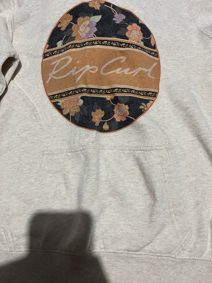 Rip Curl Floral Graphic Hoodie (Category: Coats, Jackets and Outerwear) located in Manila. Submitted by hi_abbd (Listing ID 1435427750, Image 3). Description: - Rip Curl hoodie - Features a floral graphic - Kangaroo pocket - Drawstring hood - Light color - Rip Curl logo on hem - Size: XXS Has small stain attached in the last photo Too small on me No when worn.